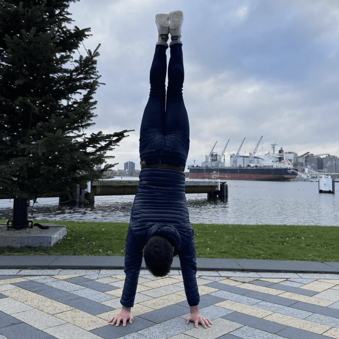 a person doing handstand